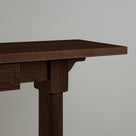 The design of the Keepsake Console Table is based on smoky stained oak, highlighting the texture and craftsmanship.