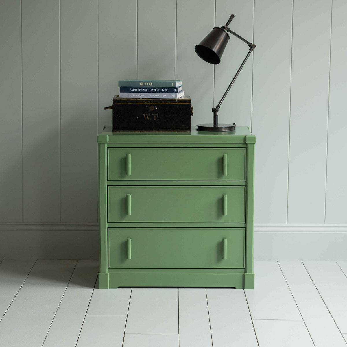 Shipshape Chest of Drawers, Sage Green With Opened Drawers With Books and Brass Lamp on the top Front View - By NiX