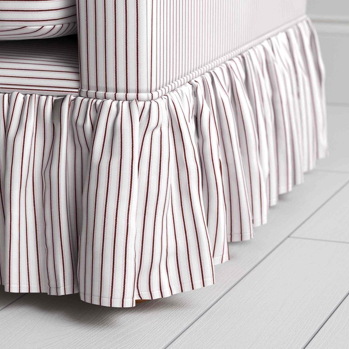 Detailed view of the gathered ruffle skirt and lower base on the Curtain Call sofa by NiX.