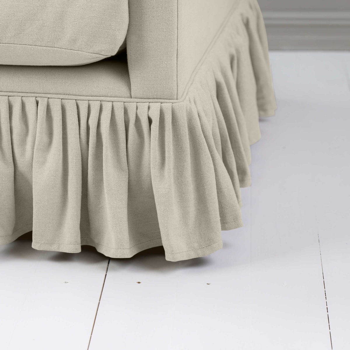 Focus on the romantic pleated linen lower trim crafted by Nicola Harding design.