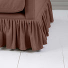 Detailed view of the gathered ruffle skirt on the Curtain Call sofa by NiX.