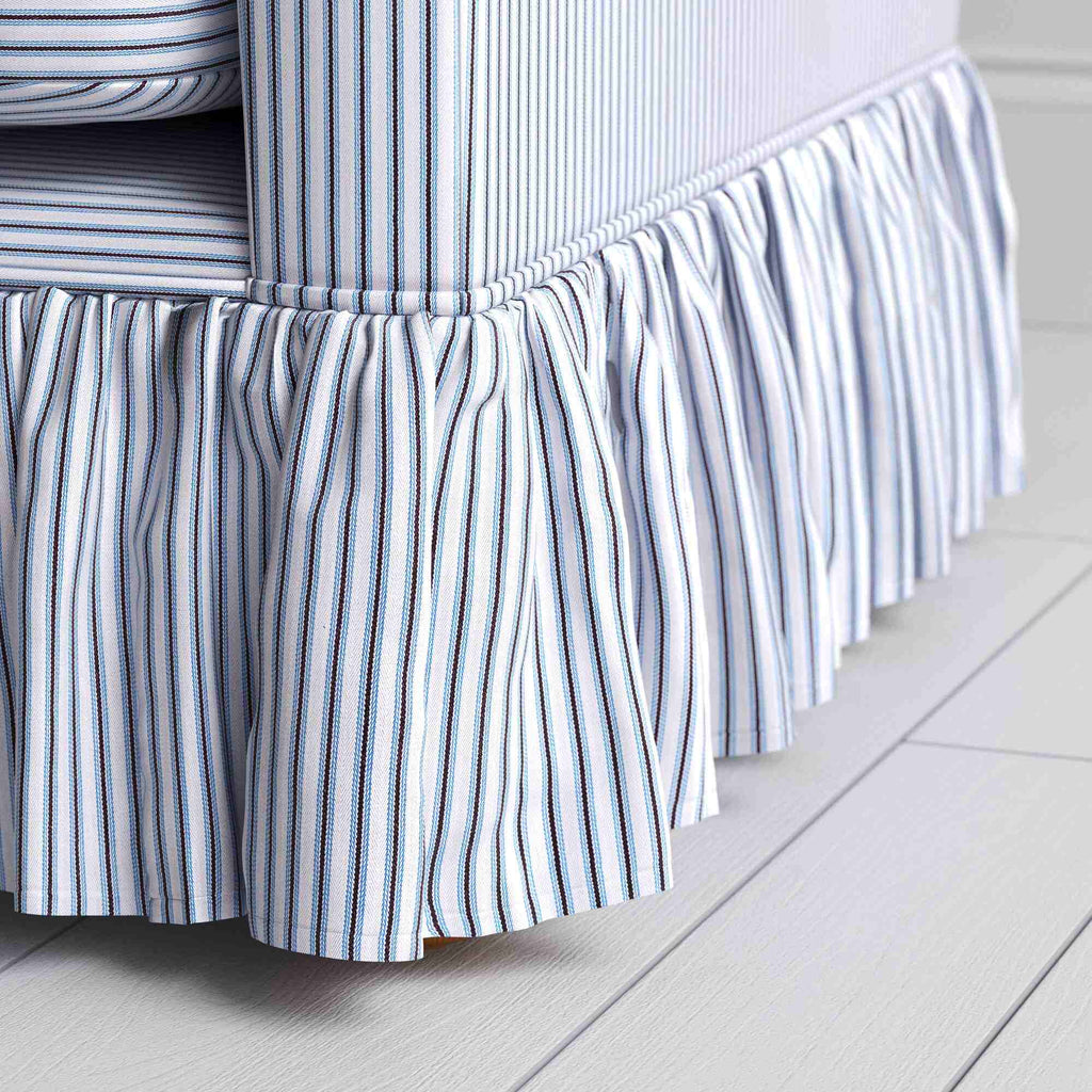  Close-up of the ruffle design on the Aqua Brown Curtain Call sofa in Ticking Cotton. 