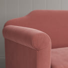 Macro detail of premium upholstery stitch lines on a Nicola Harding design love seat.