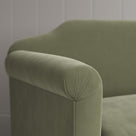 Macro detail of premium upholstery stitch lines on a Nicola Harding design love seat.