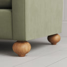 Detail of the spherical timber feet on the NiX furniture love seat.