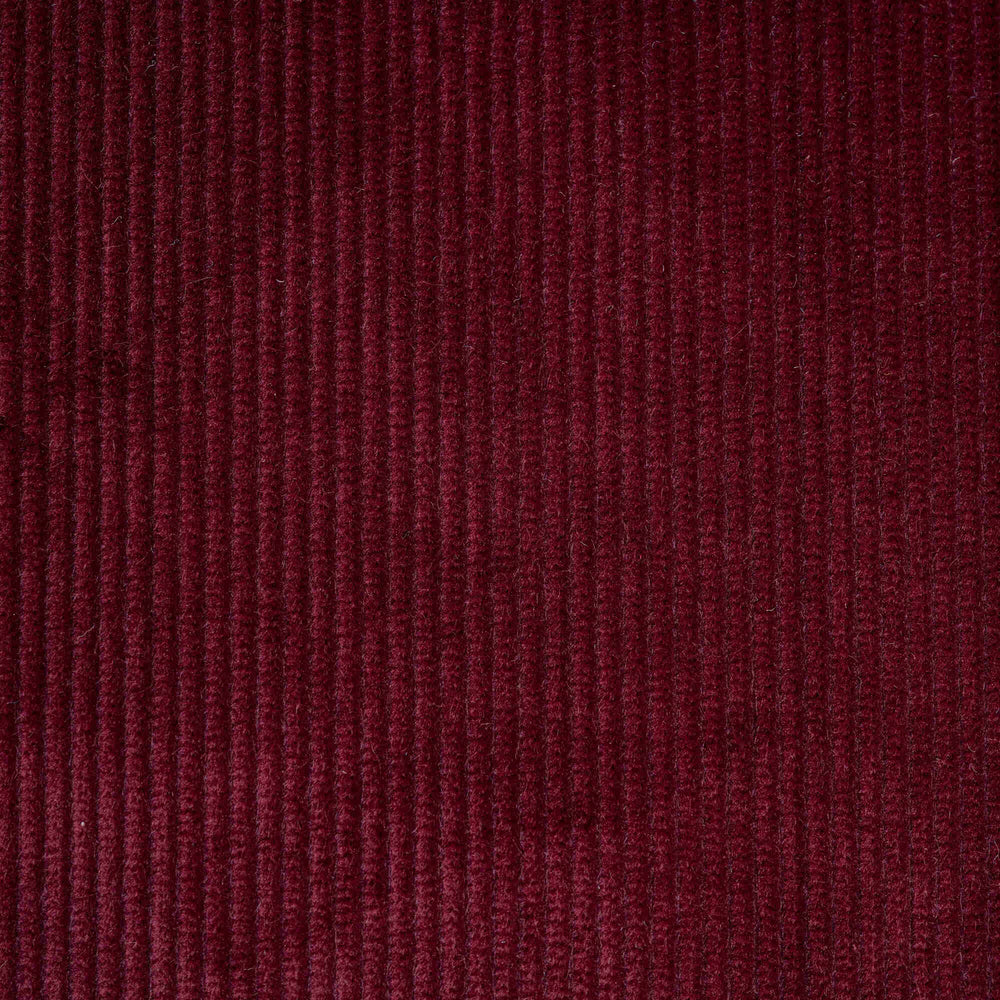 Flat lay of Cherry Classic Corduroy, a warm red ribbed cotton fabric for luxury seating.