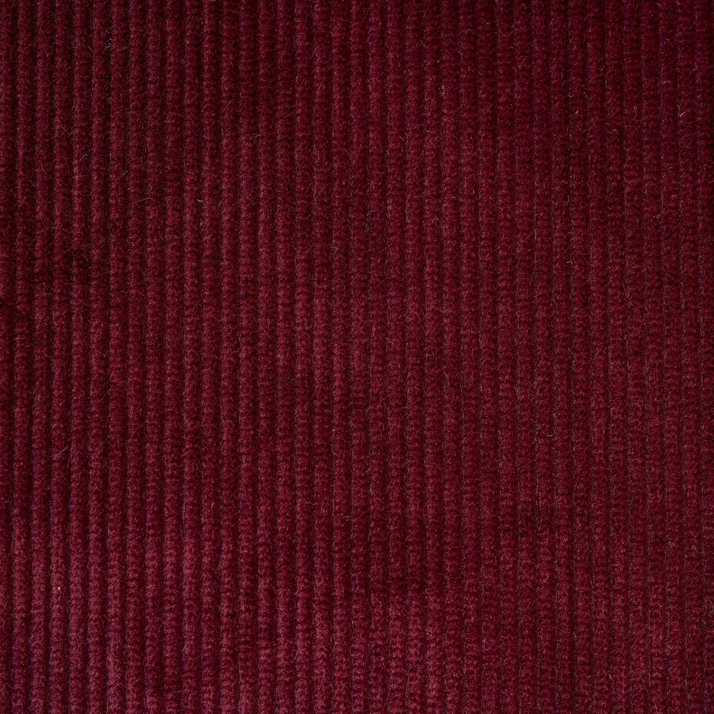  Flat lay of Cherry Classic Corduroy, a warm red ribbed cotton fabric for luxury seating. 