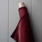 Roll of Cherry Classic Corduroy fabric for bespoke Nicola Harding upholstery.