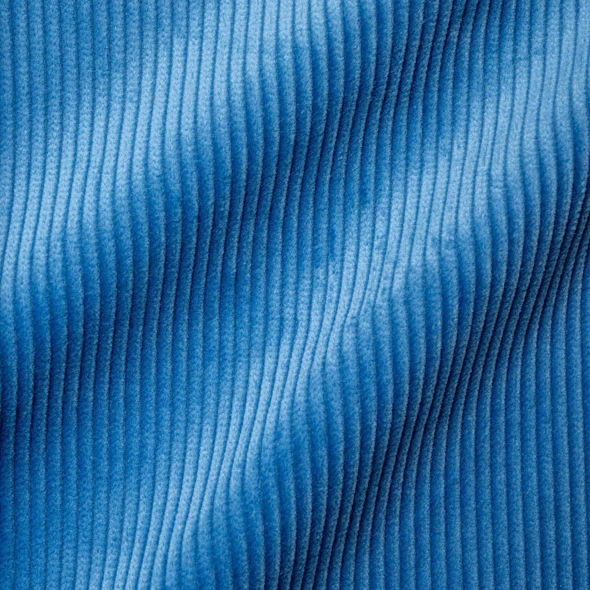 Flat lay of Harbour Blue Classic Corduroy, a rich navy ribbed fabric for luxury seating.