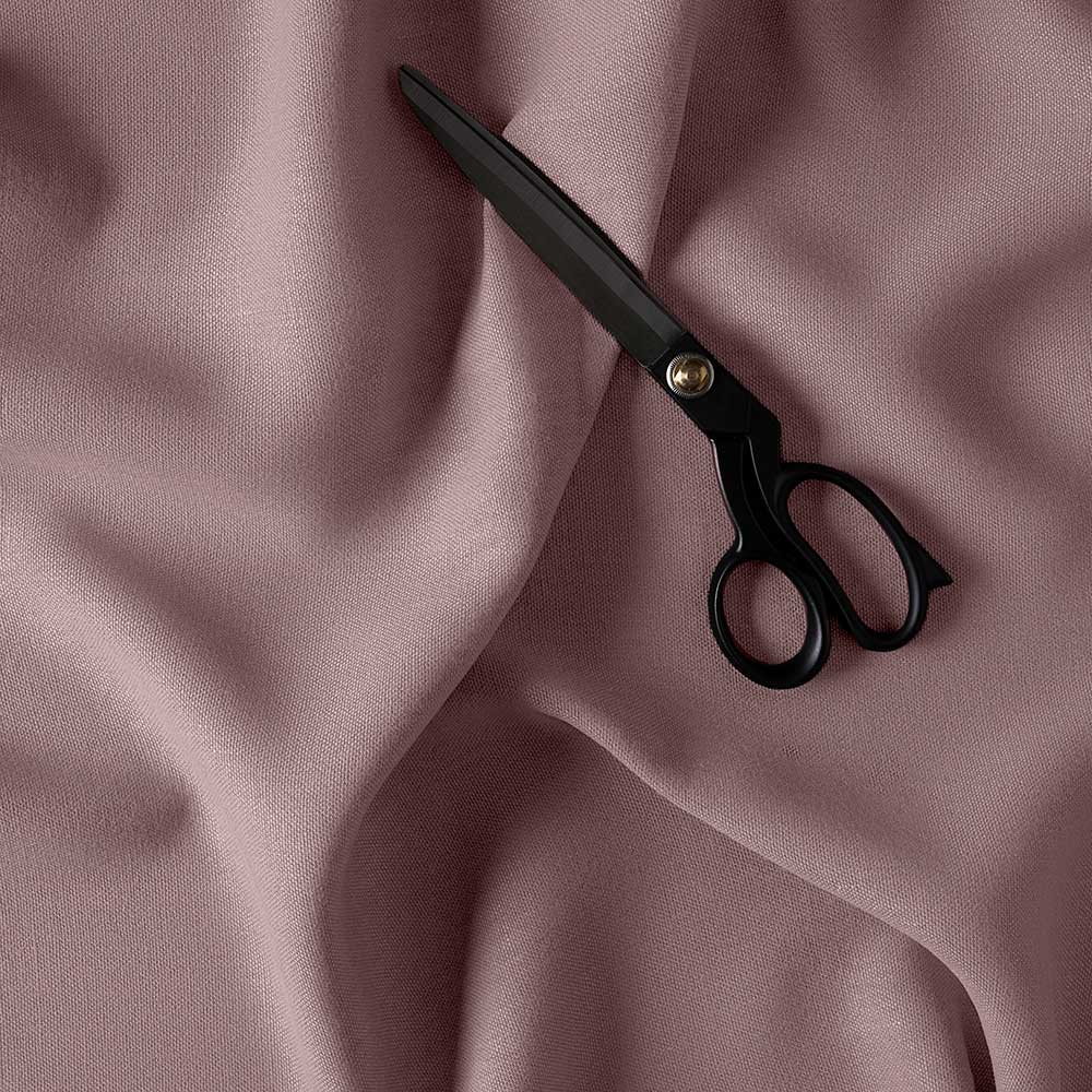Laidback Linen heather fabric with black scissor on it.