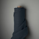 Fabric roll of Midnight blue linen by Nicola Harding.
