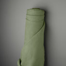 Roll of Moss Laidback Linen fabric for upholstery by Nix.