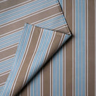 Detailed view of folded blue Regatta cotton material by Nicola Harding.