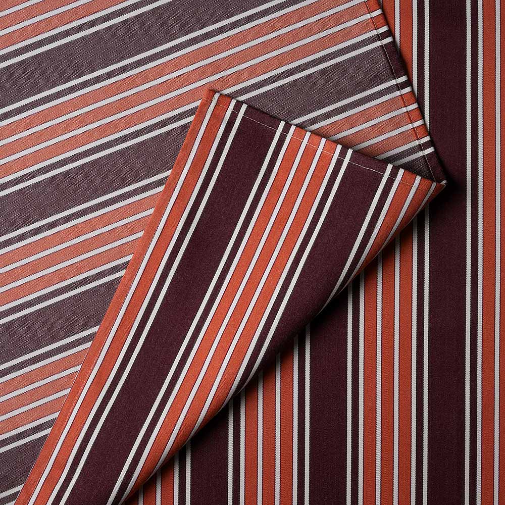 Detailed view of folded Flame Regatta cotton material by Nicola Harding.
