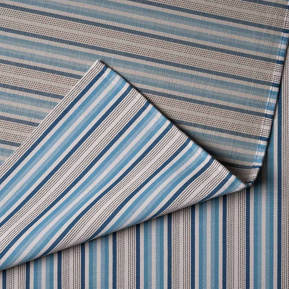 Detailed view of folded blue Slow Lane cotton linen fabric by Nicola Harding.