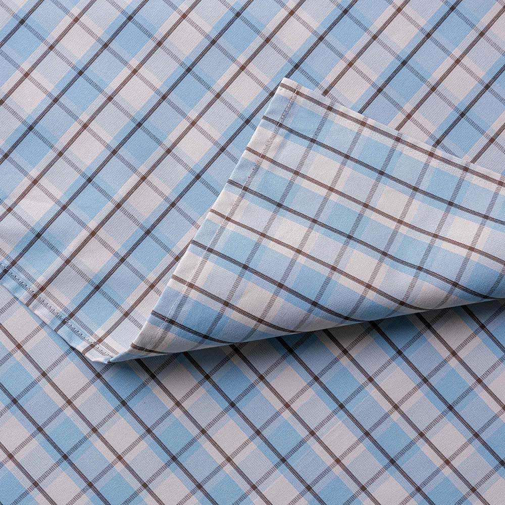  Detailed view of folded Square Deal cotton material in blue brown 
