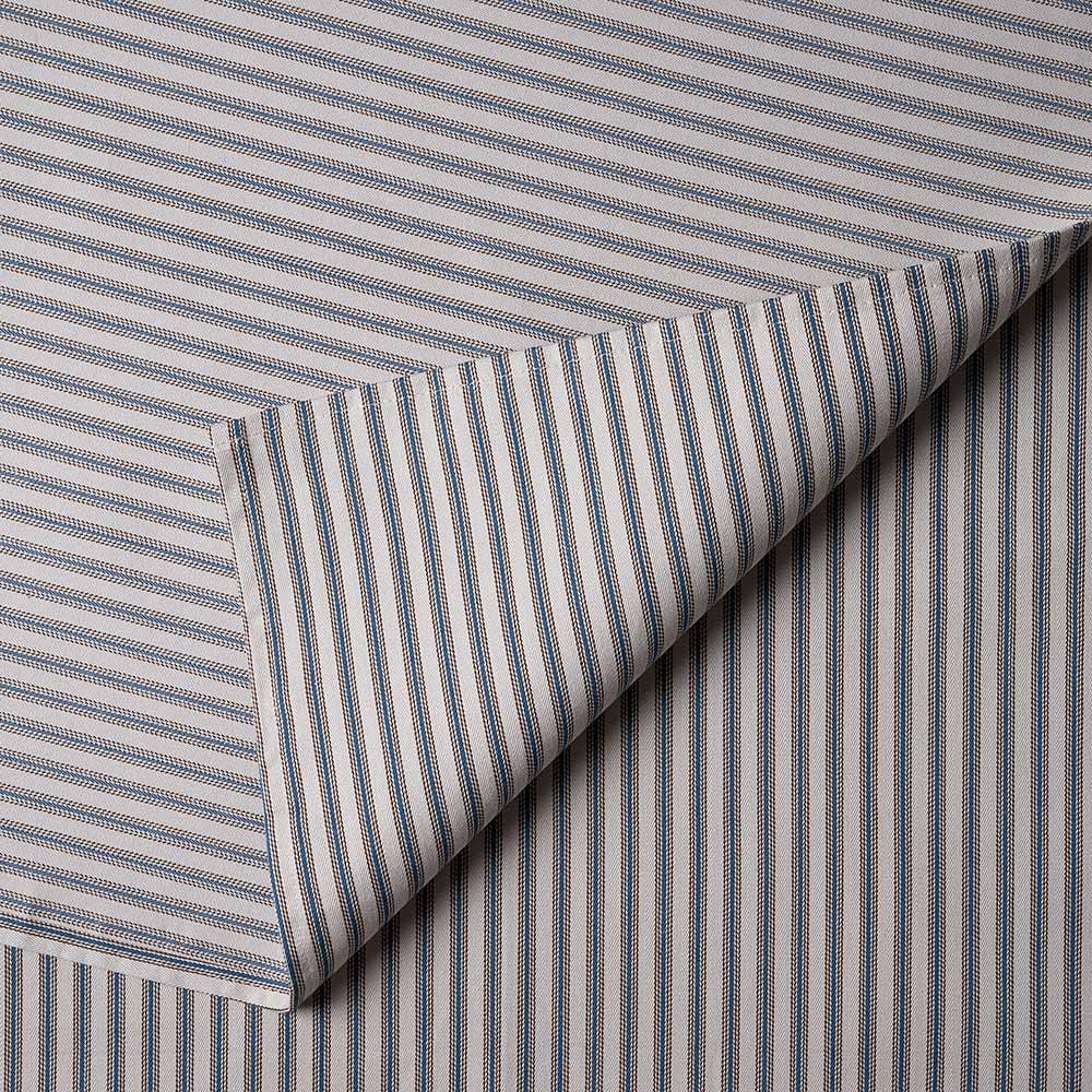  Detailed view of draped ticking cotton fabric showing the refined stripes used by Nicola Harding. 