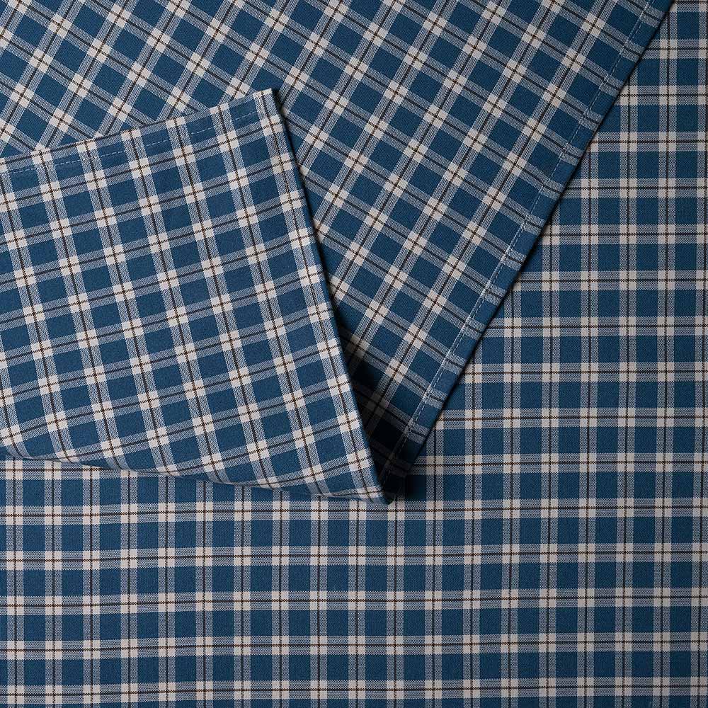  Close-up of the folded plaid cotton material used by Nix. 