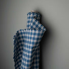 Roll of Well Plaid cotton in blue and brown used for bespoke British furniture by Nicola Harding.