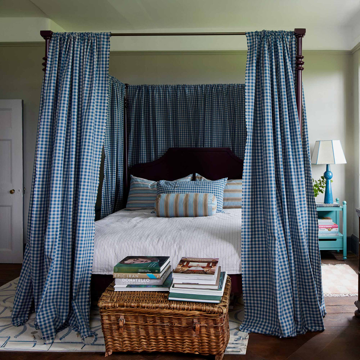 A beautifully decorated bedroom featuring the Folly Four Poster Bed in Plum, designed by NiX by Nicola Harding & Co.