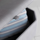 A close up of stylish grey ottoman. - NiX