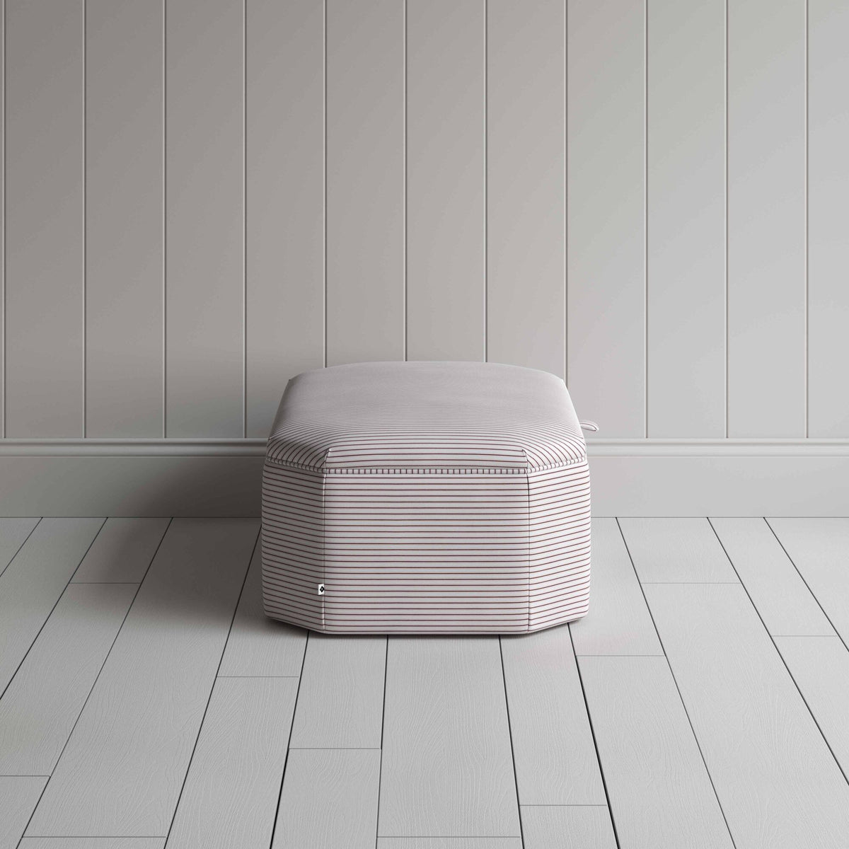 Stylish striped ottoman against white flooring. Side View - NiX