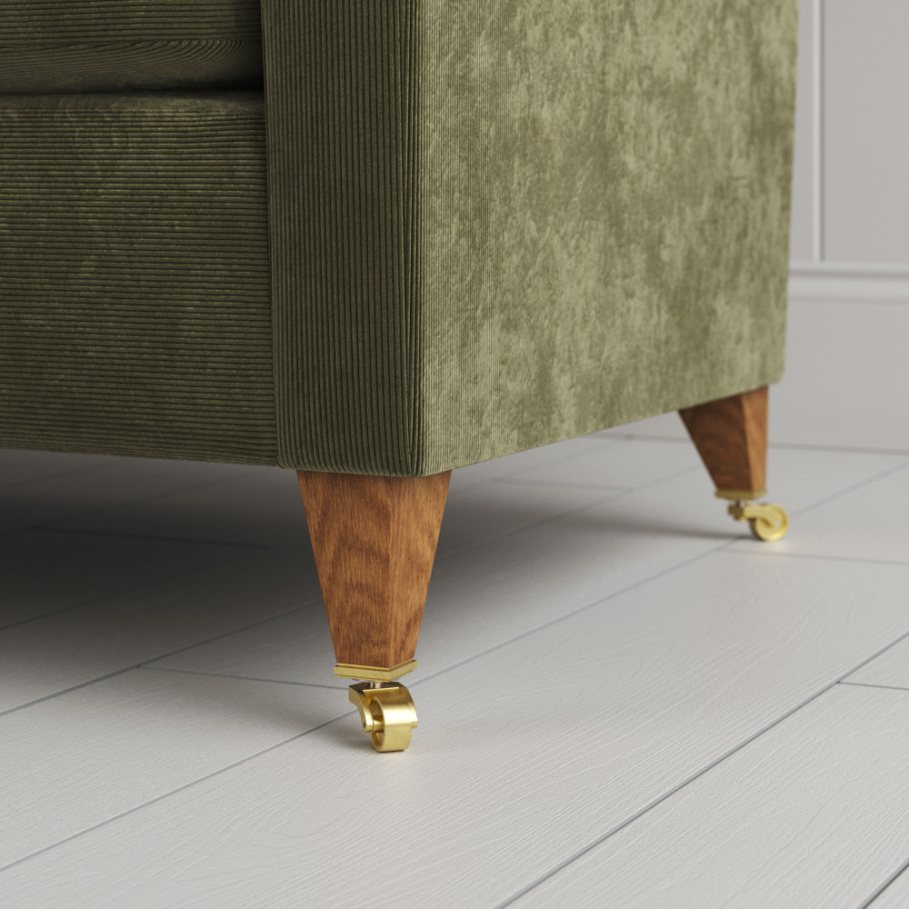  Idler 4 seater sofa close-up detail of tapered timber legs with castors by NiX. 