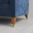 Idler 4 seater sofa close-up detail of tapered timber legs with castors by NiX.