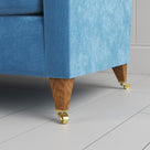 Idler sofa close-up detail of tapered timber legs with castors by NiX.