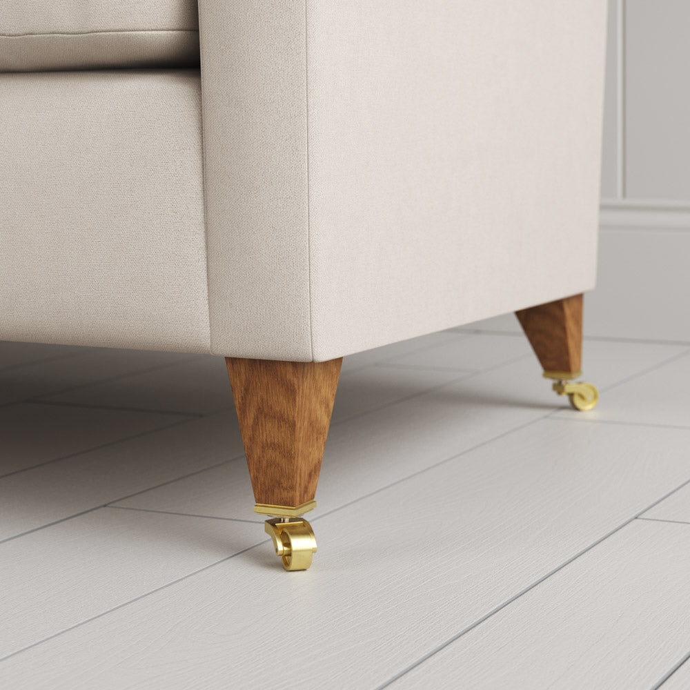  Tapered feet and castors on the Dove linen Idler seat by Nix. 