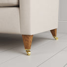 Tapered feet and castors on the Dove linen Idler seat by Nix.