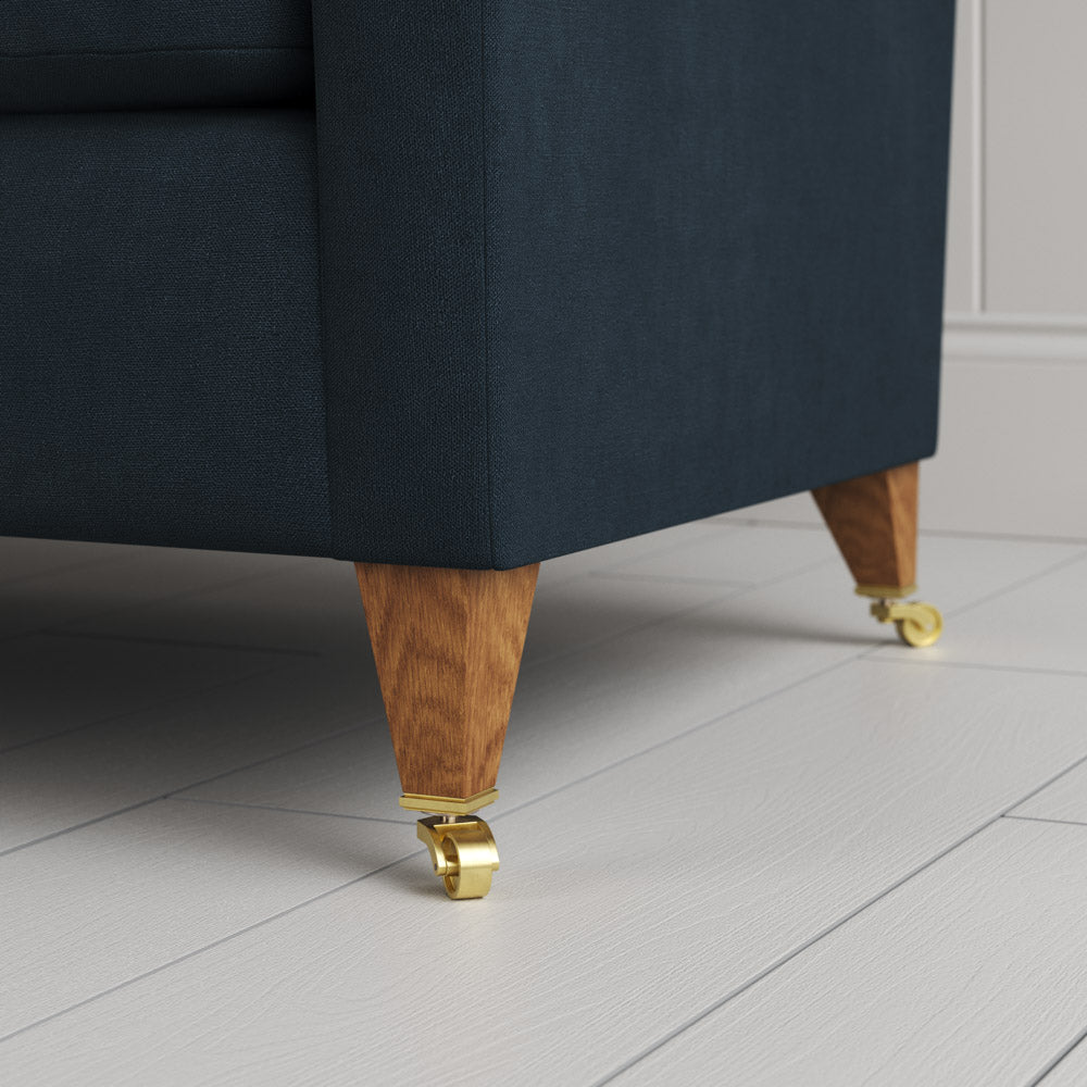  Tapered feet and castors on the Midnight linen Idler seat by Nix. 