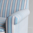 Close-up of the tailored blue cotton linen armrest on the Idler by Nix.