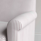 Detailed view of the tailored ticking stripe armrest, demonstrating precision British craftsmanship on the Idler by Nix.