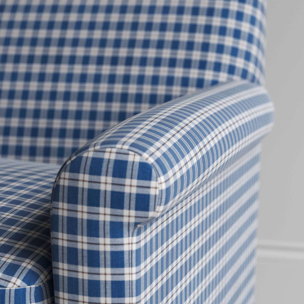  Detail of the upholstered armrest showcasing the precise stitching and refined British craftsmanship by NiX 