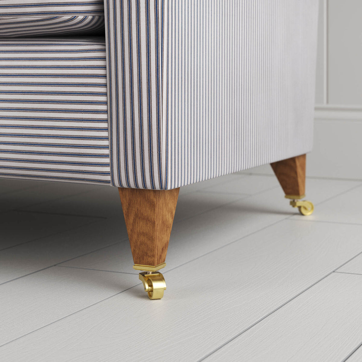 Idler sofa leg with caster wheel close-up by Nicola Harding
