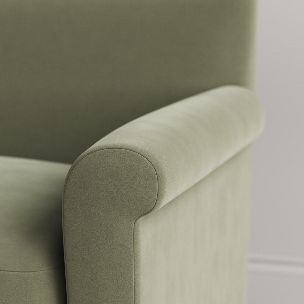 Close-up of Velvet Green Tea love seat armrest by Nicola Harding