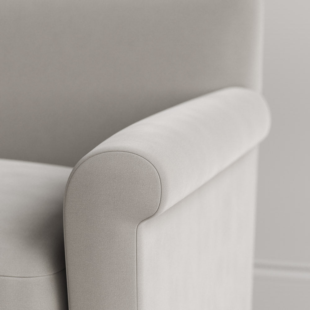  Close-up of the tailored armrest on the Moonstone velvet Idler by Nix. 