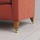 Tapered feet with castors on the Idler 3 Seater Sofa in Intelligent Velvet Sienna