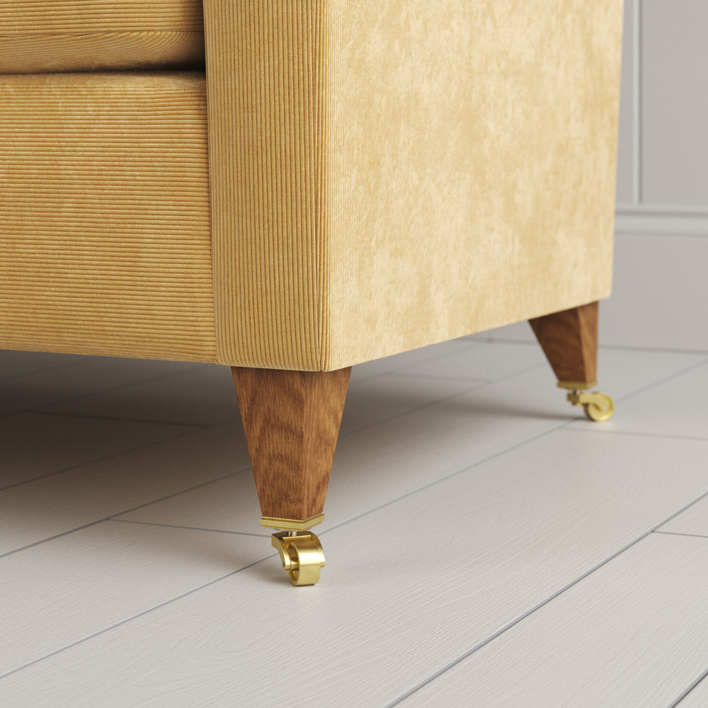  Idler sofa close-up detail of tapered timber legs with castors by NiX. 
