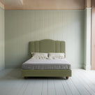 King Size Cloud Nine Upholstered Bed in Intelligent Velvet Green Tea front view with mattress and pillows.