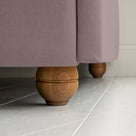 Dream Ticket Upholstered Bed in Laidback Linen Heather without Valance, with a rounded footboard design in close-up.