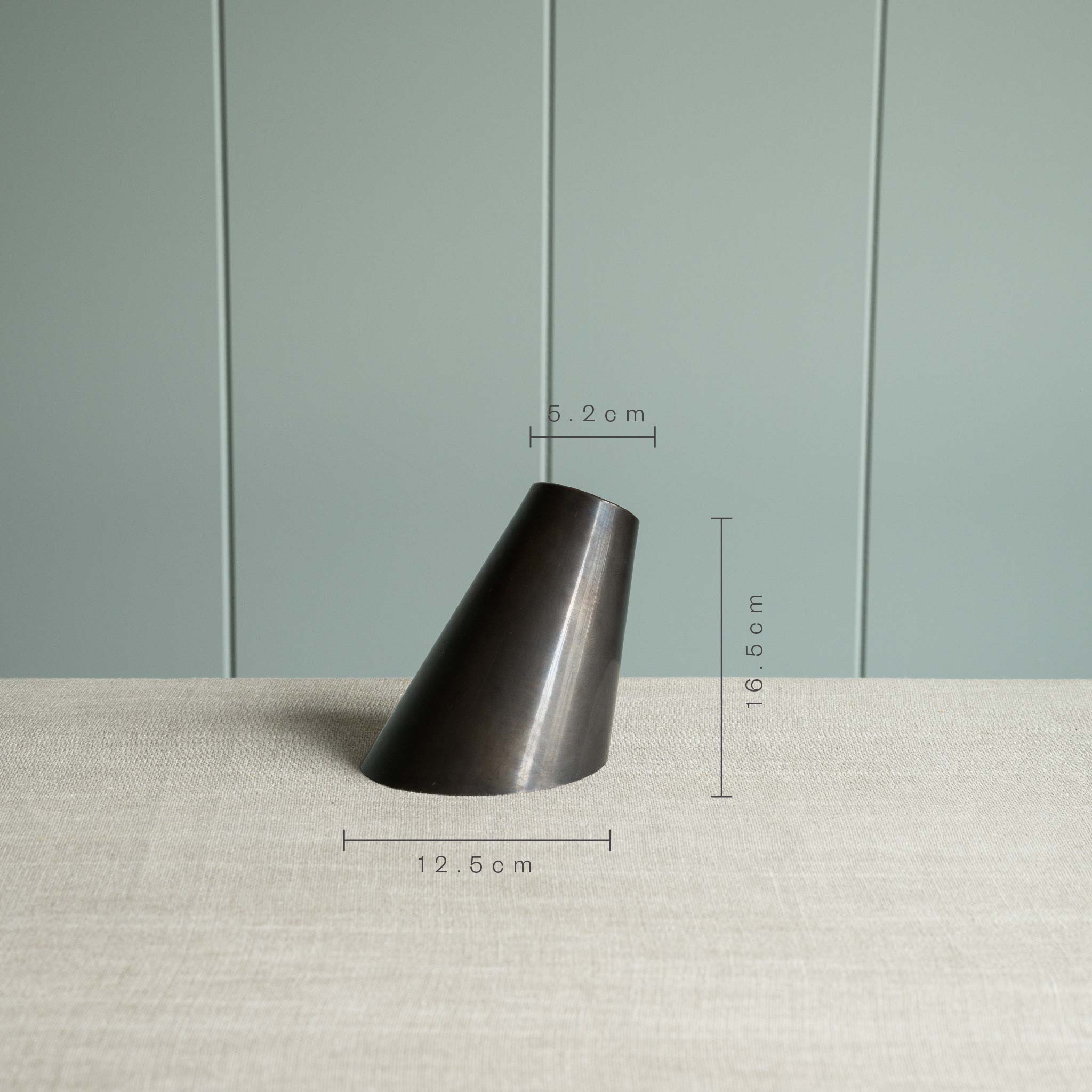  A black part of lamp, a simple yet measuring image. 