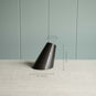  A black part of lamp, a simple yet measuring image. 