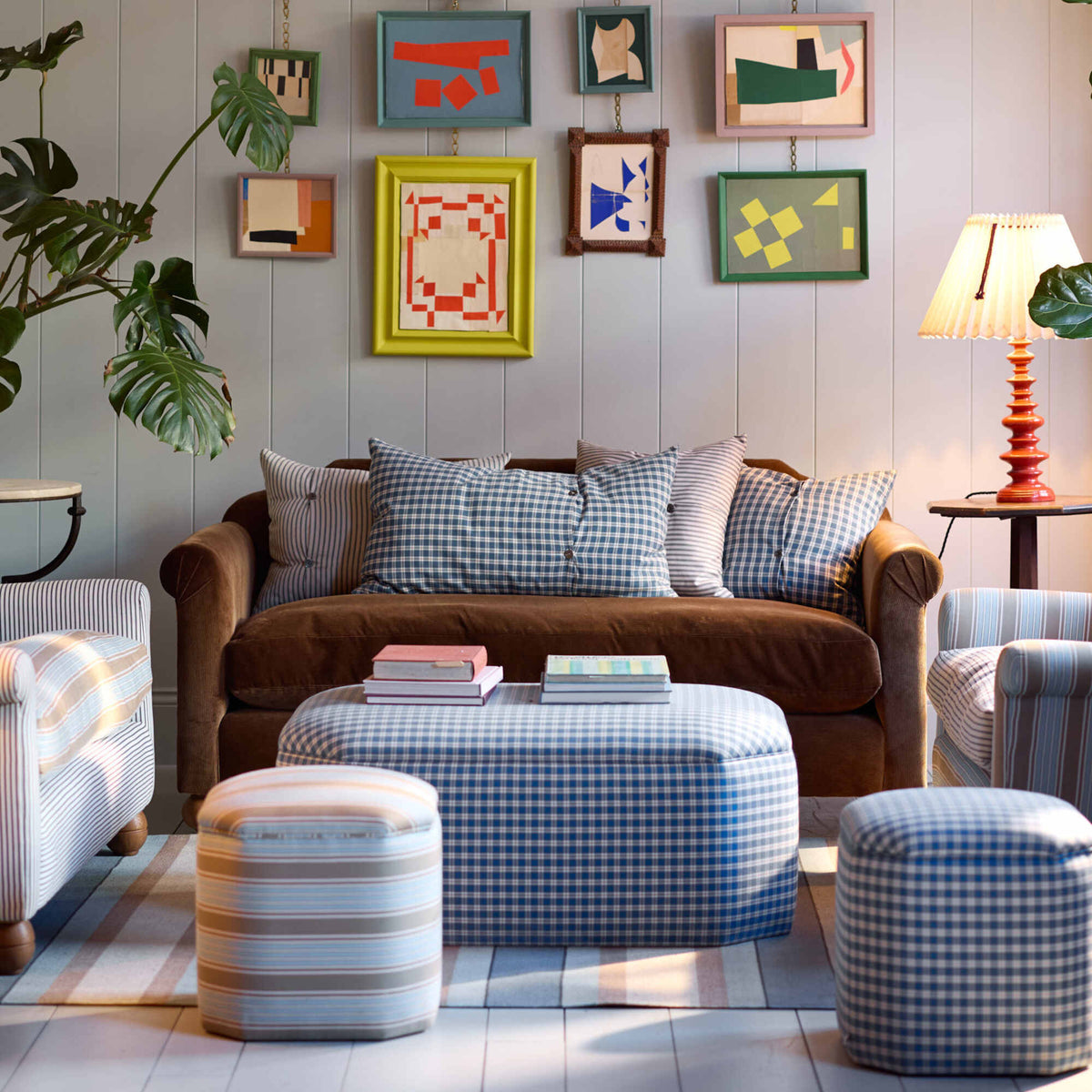 NiX furniture Dolittle sofa featured in a colorful living room setup with a large checkered storage ottoman