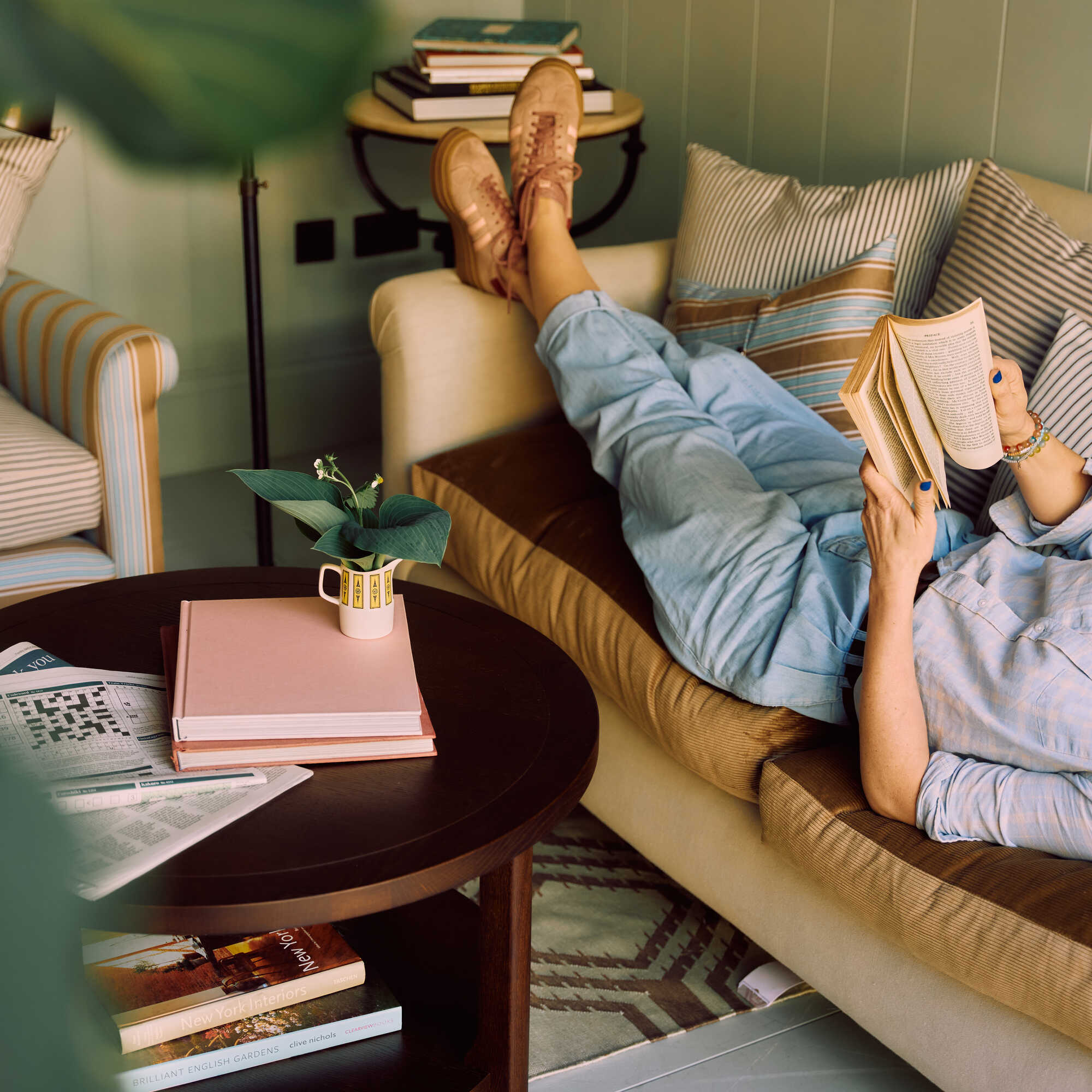  Nicola Harding interiors Dolittle 3 seater sofa styled lifestyle scene with a person reading a book 