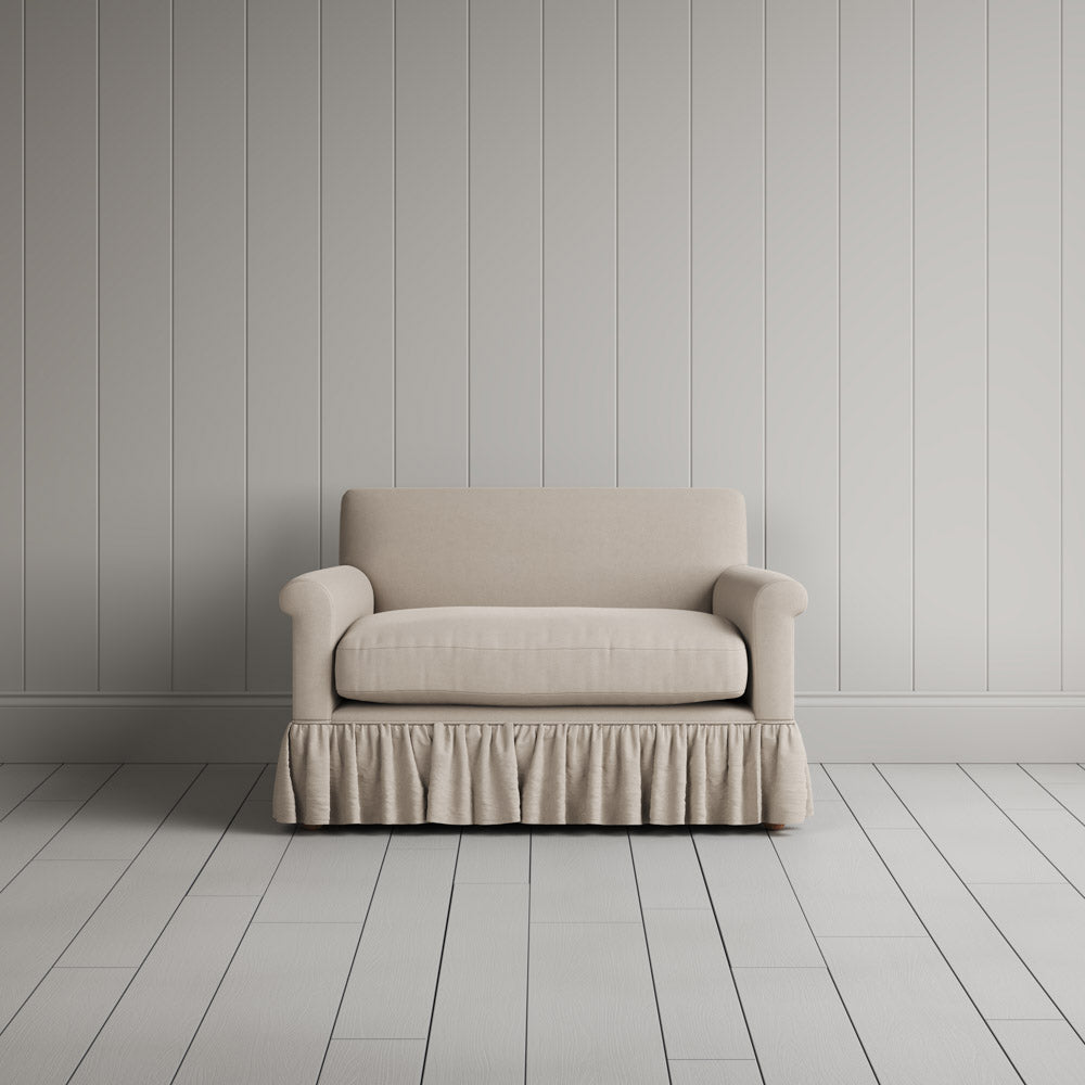  Curtain Call Love Seat playful skirted design in laidback linen dove, front studio view. 
