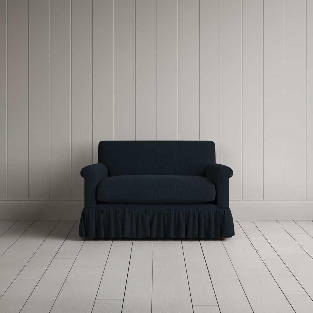  NiX furniture compact midnight linen sofa with gathered valance skirt, front view. 