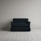 NiX furniture compact midnight linen sofa with gathered valance skirt, front view.