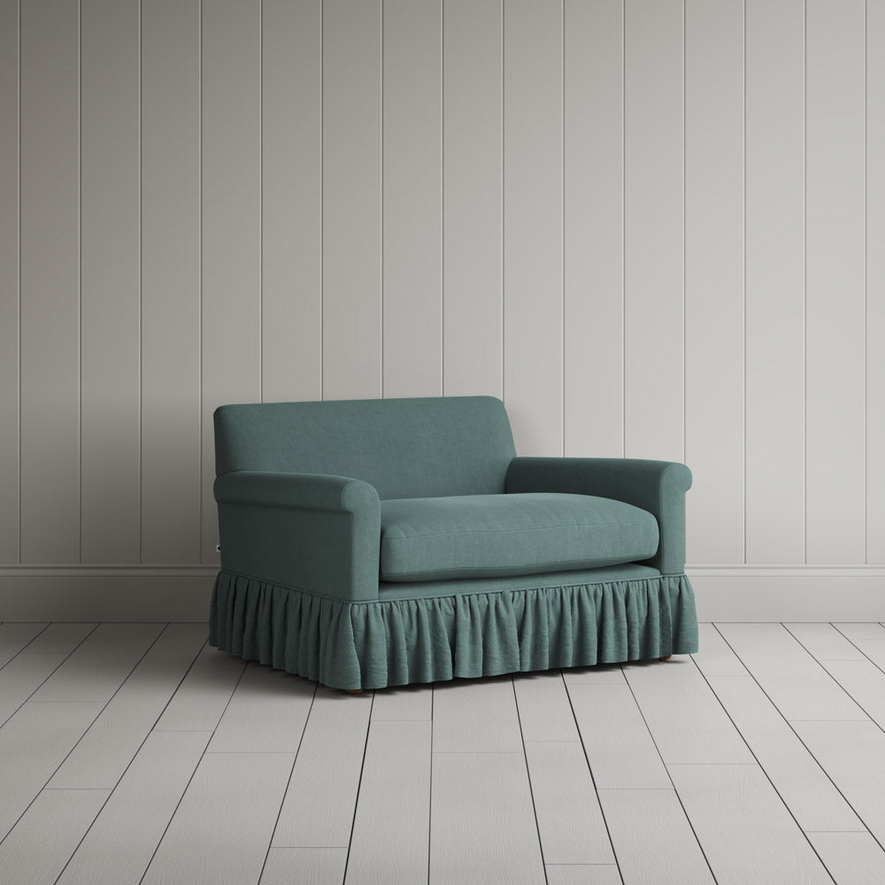 Curtain Call Love Seat skirted small sofa in laidback linen mineral, angled view by NiX.